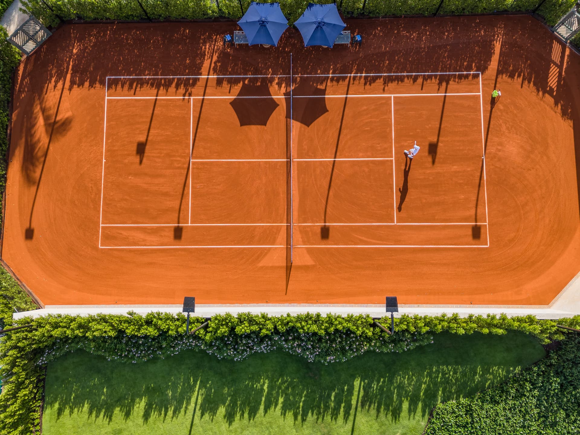 Clay tennis court seen from above